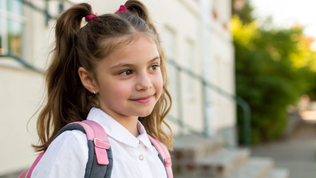 Girl with quick and cute hairstyle ready for school, showcasing simple 5-minute morning hairstyles for busy school days