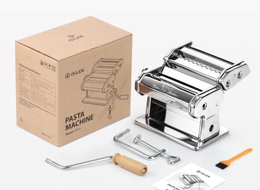 Rolling pasta dough through the ISILER pasta maker for perfect homemade pasta.